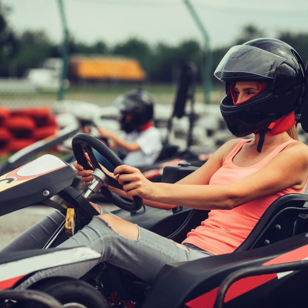 a mother and son racing on petrol go karts
