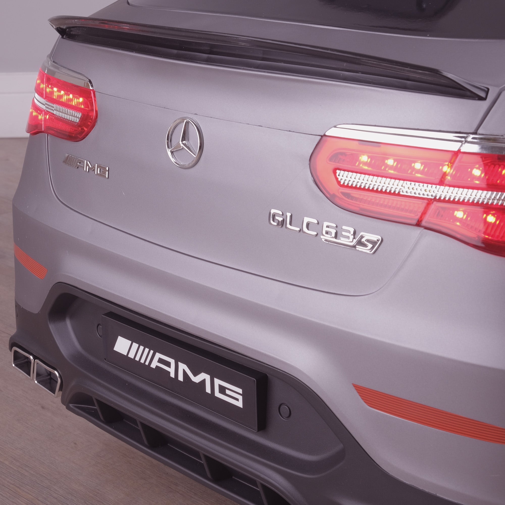 kids 12v electric mercedes glc 63s coupe battery car jeep pick up battery operated ride on car with parental remote control mat gray rear close up view benz amg licensed 2wd