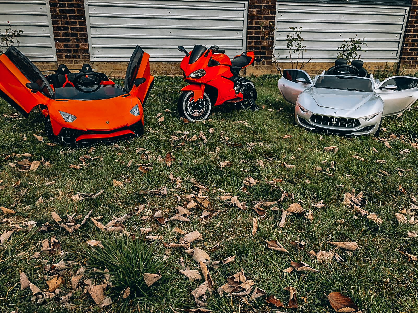 2 ride on supercars and a Ducati motorbike