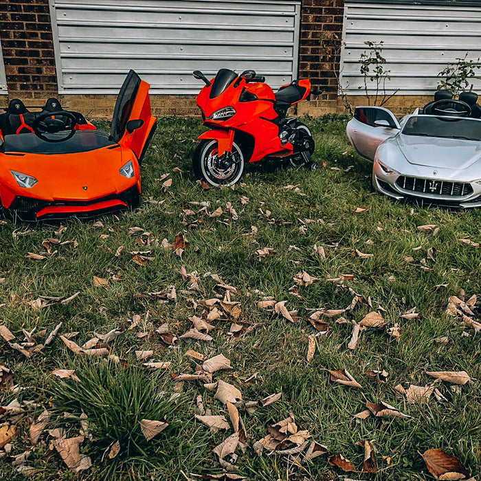 2 ride on supercars and a Ducati motorbike