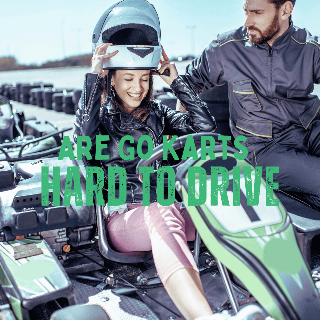 A young woman putting on her helmet on a go kart track