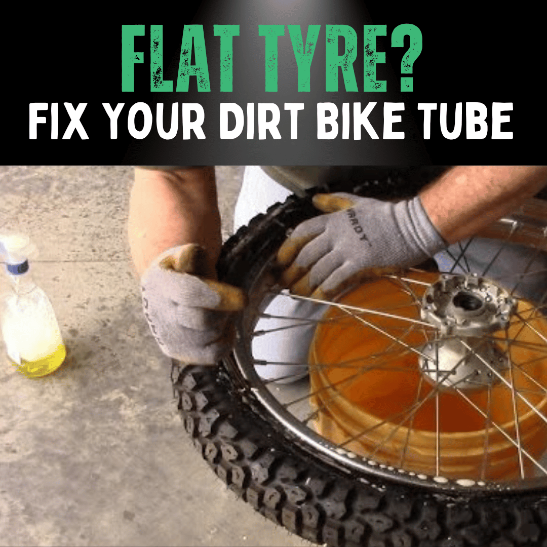 hands being shown fixing a dirt bike tyre