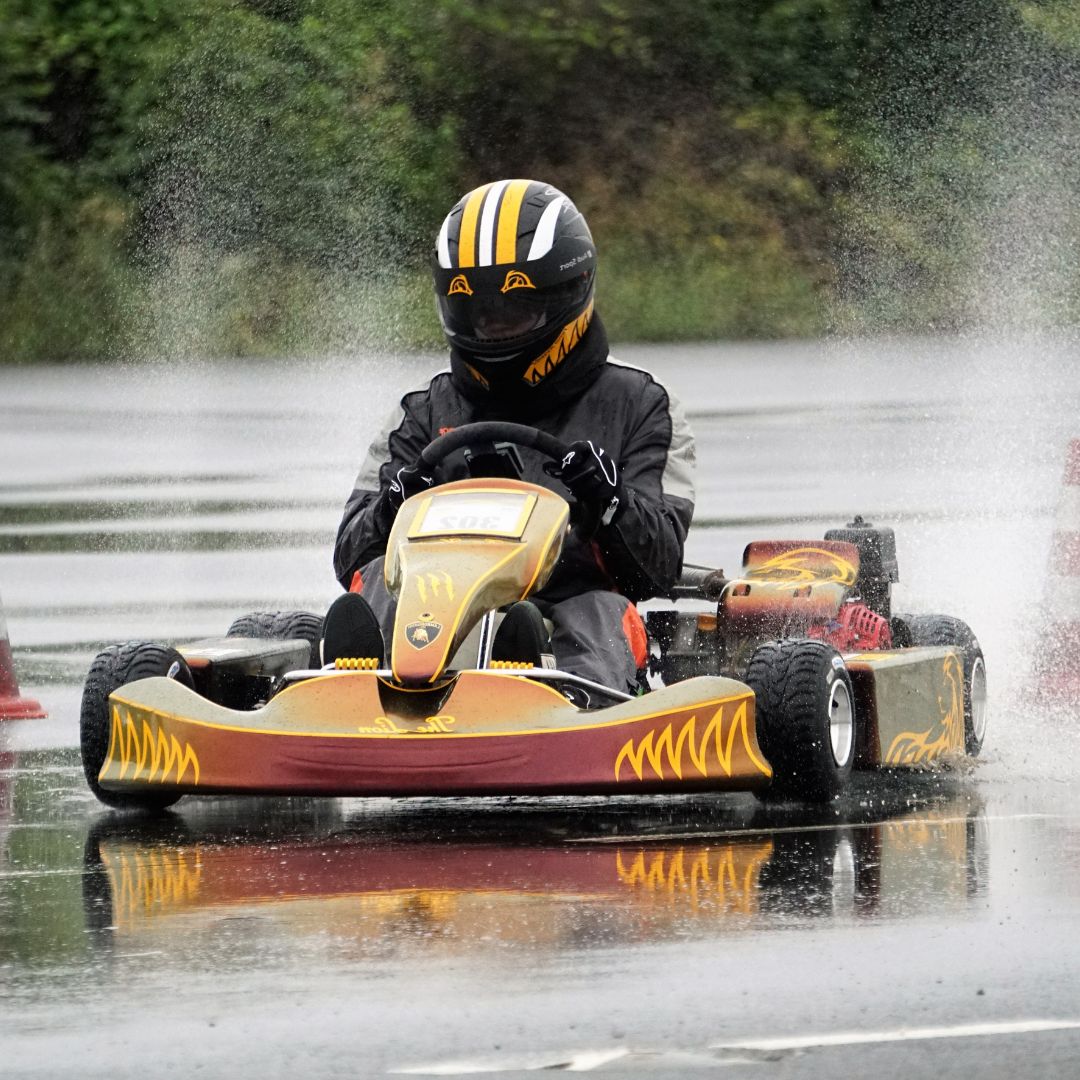 Go kart racer on a we track