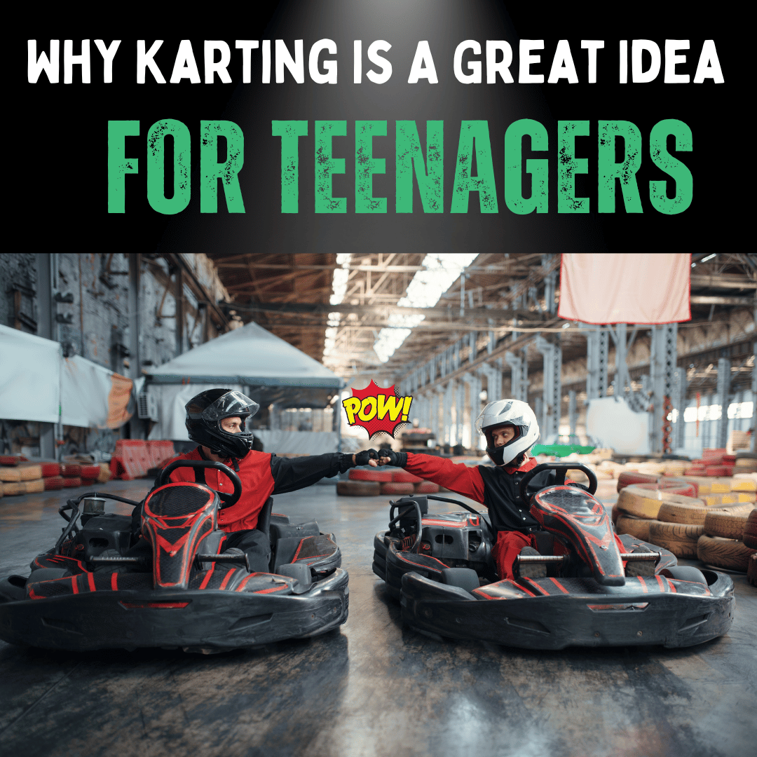 Two teens touching gloves on a go kart track