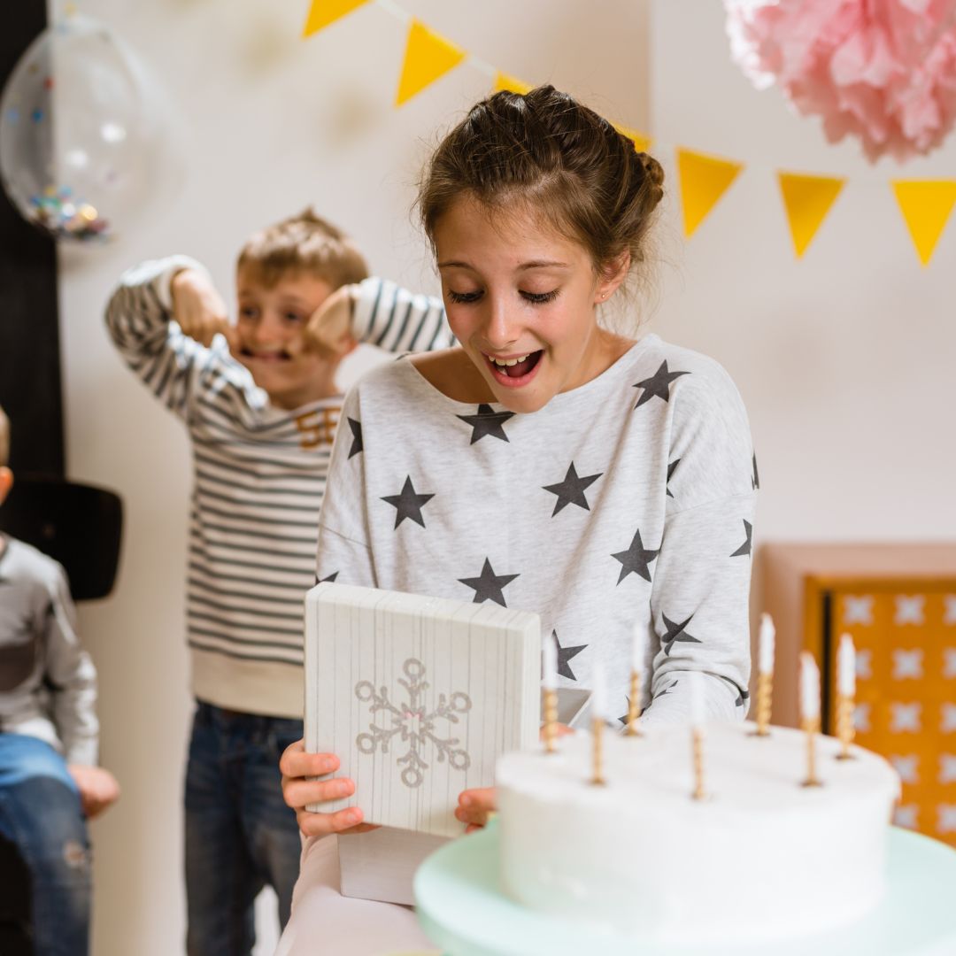 girl opening her party box