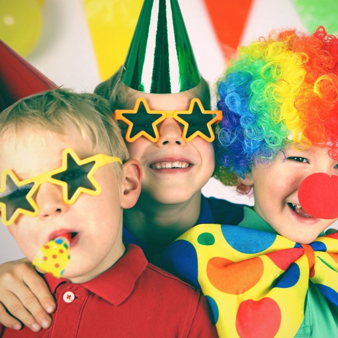 Three kids at a birthday party