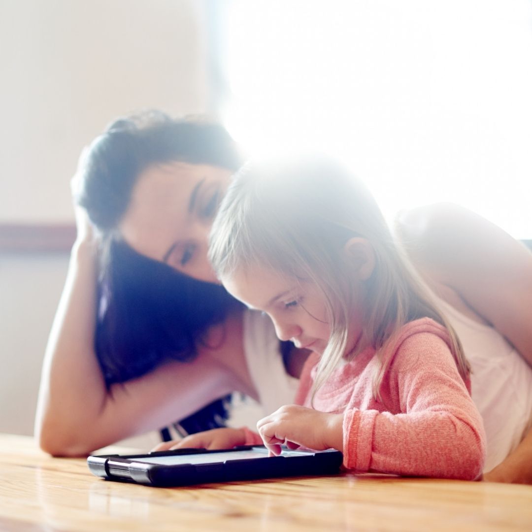 mother with her child using a tablet