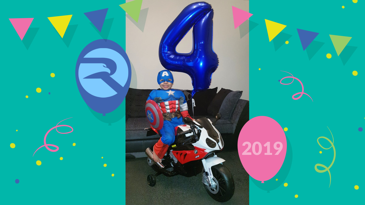 child in Captain America superhero sitting on BMW S1000RR ride on motorbike