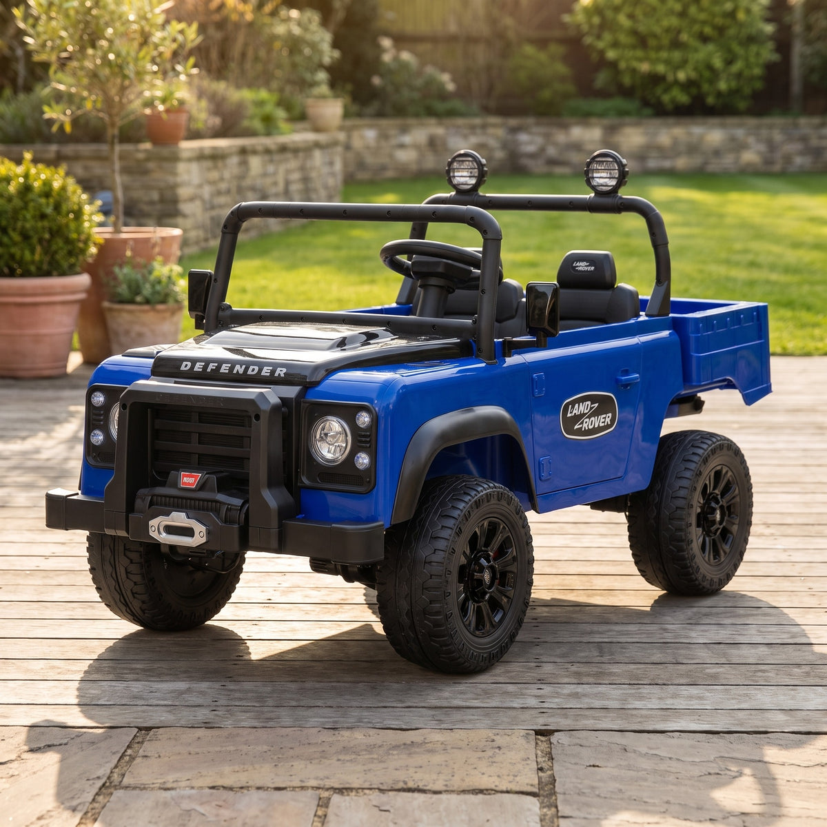 08-licensed-land-rover-defender-90-24v-kids-electric-ride-on-car-blue-garden-lifestyle.jpg